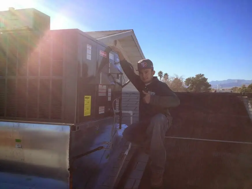 HVAC technician performing HVAC Inspection on a rooftop unit in Ladera Heights